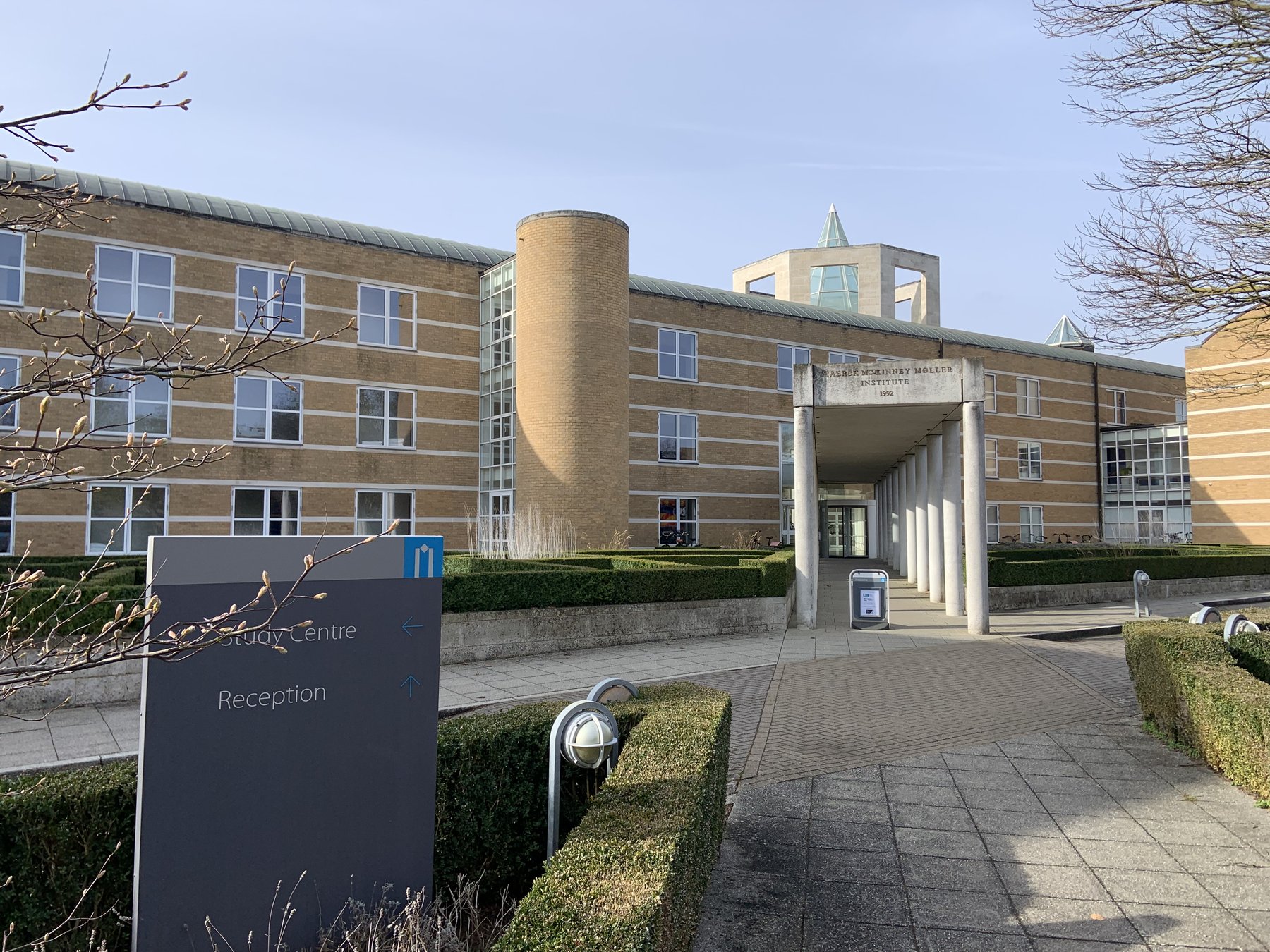 The Møller Institute at Churchill College, Cambridge — the iconic octagonal tower rises above the long stone façade